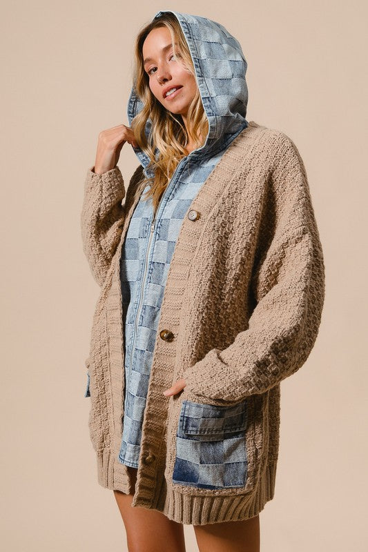 a woman wearing a hooded jacket and shorts