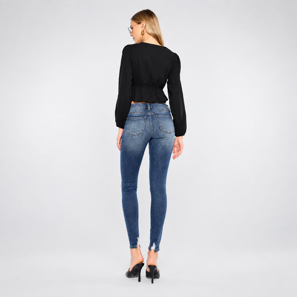 KanCan women's dark wash skinny jeans rear view showing back patch pockets, yoke stitching and faded seat