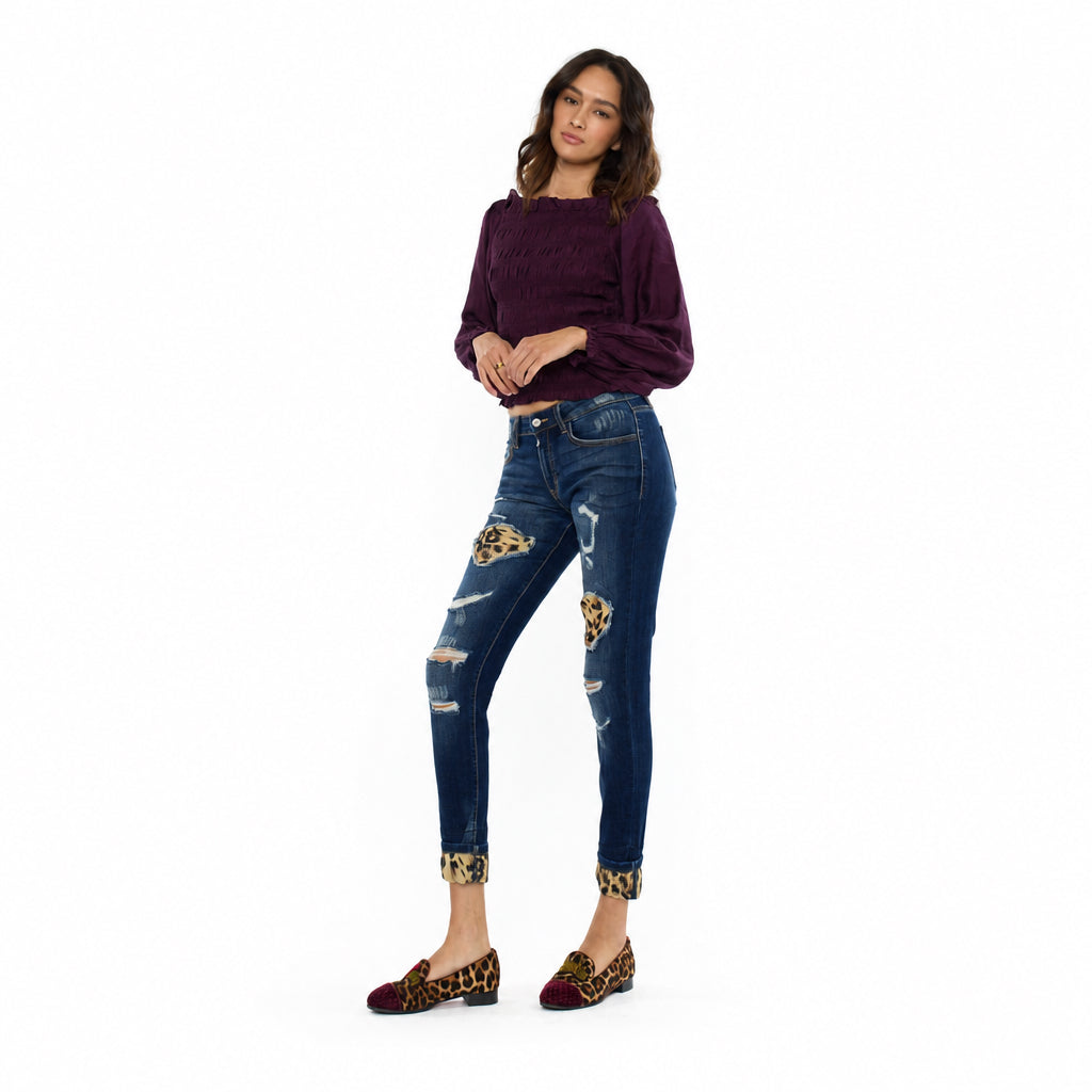 KanCan women's dark wash leopard patch skinny jeans with cuffed ankles, three-quarter front view