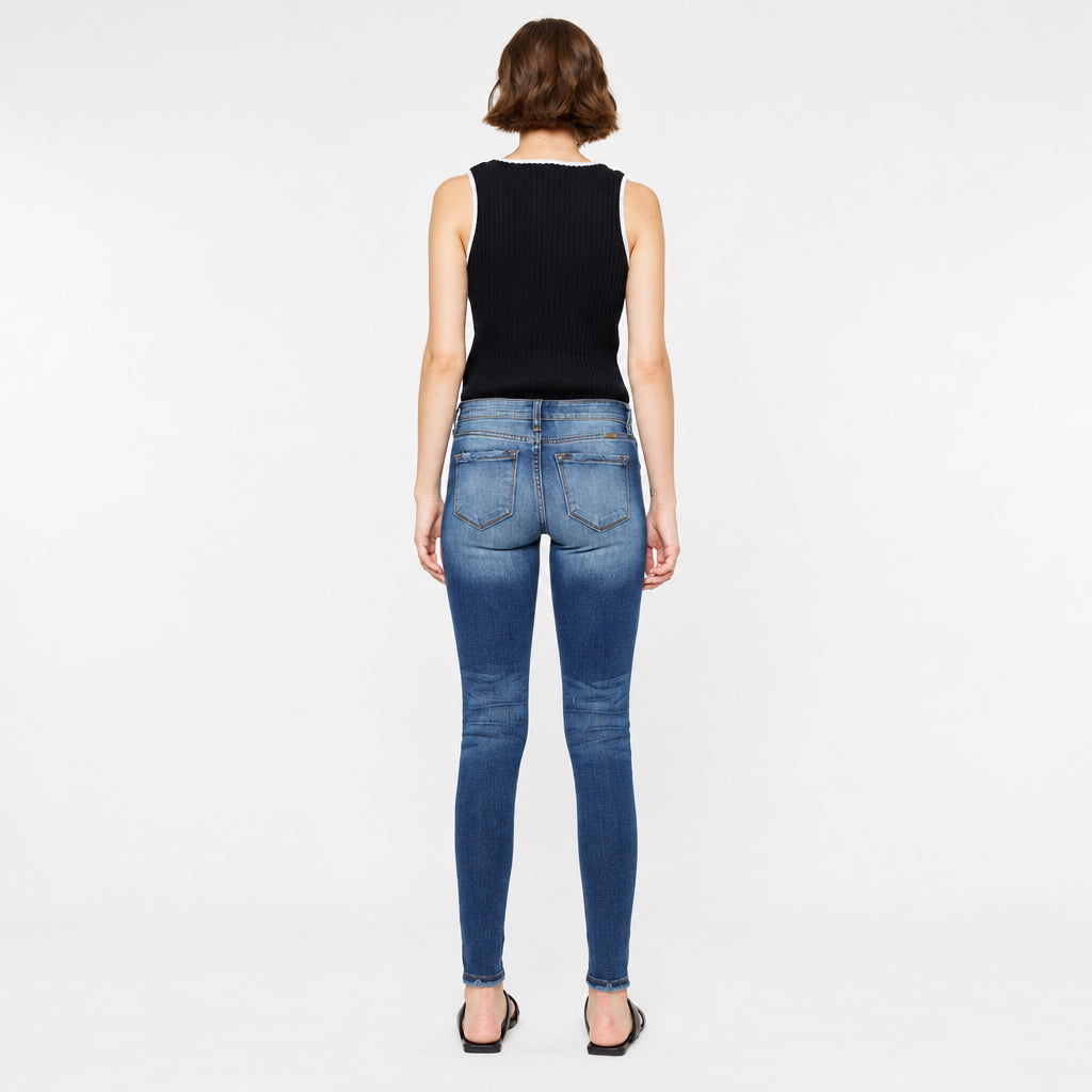 KanCan women's dark wash super skinny jeans back view showing faded seat, patch pockets and slim ankle hems