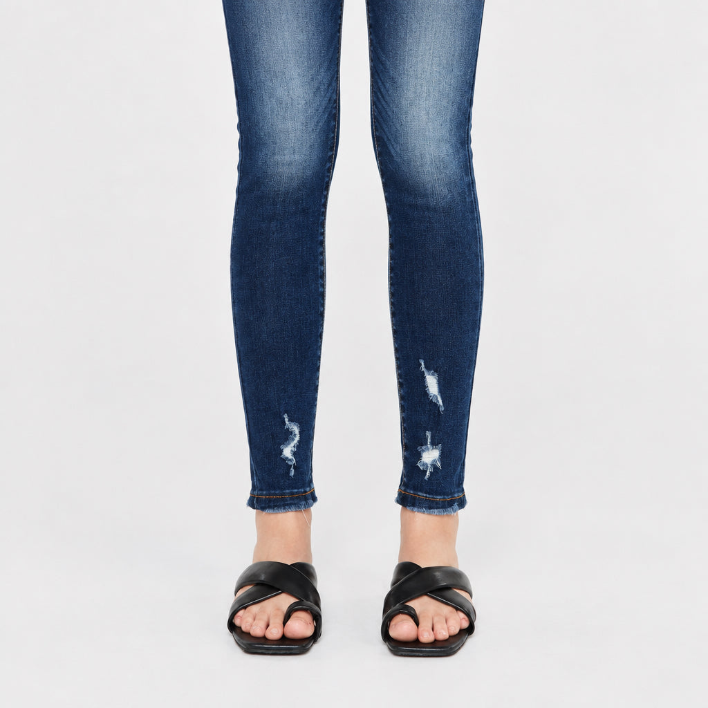 KanCan women's dark wash super skinny jeans lower-leg detail showing frayed distress accents and sewn hems