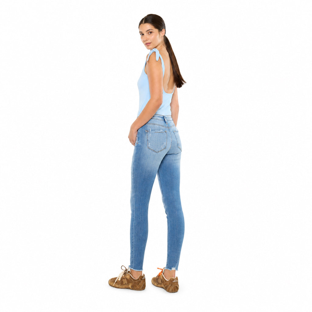 KanCan women's medium wash skinny jeans, rear three-quarter view showing patch back pockets and fitted ankle legs