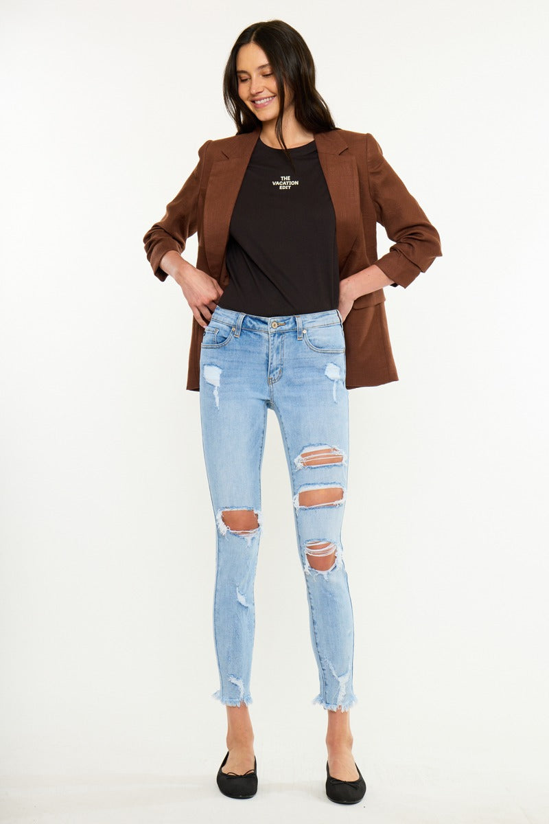 KanCan Skinny Augustina Mid-Rise Jeans studio front view displaying raw frayed hem