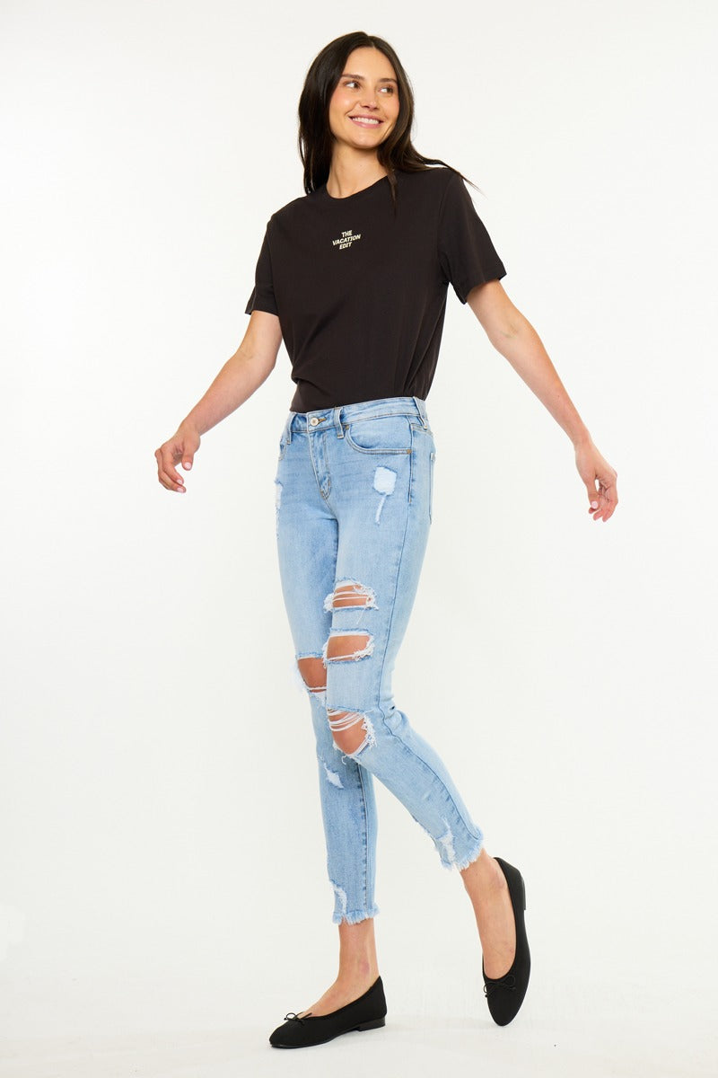 KanCan Skinny Augustina Jeans close-up of light wash denim whiskering and knee distressing