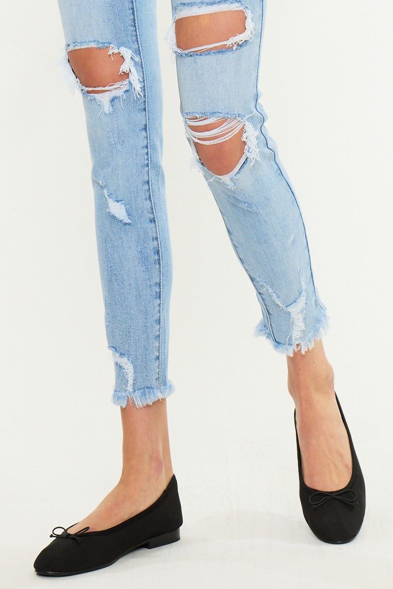 KanCan Skinny Augustina Jeans close-up of light wash denim whiskering and knee distressing - lower half