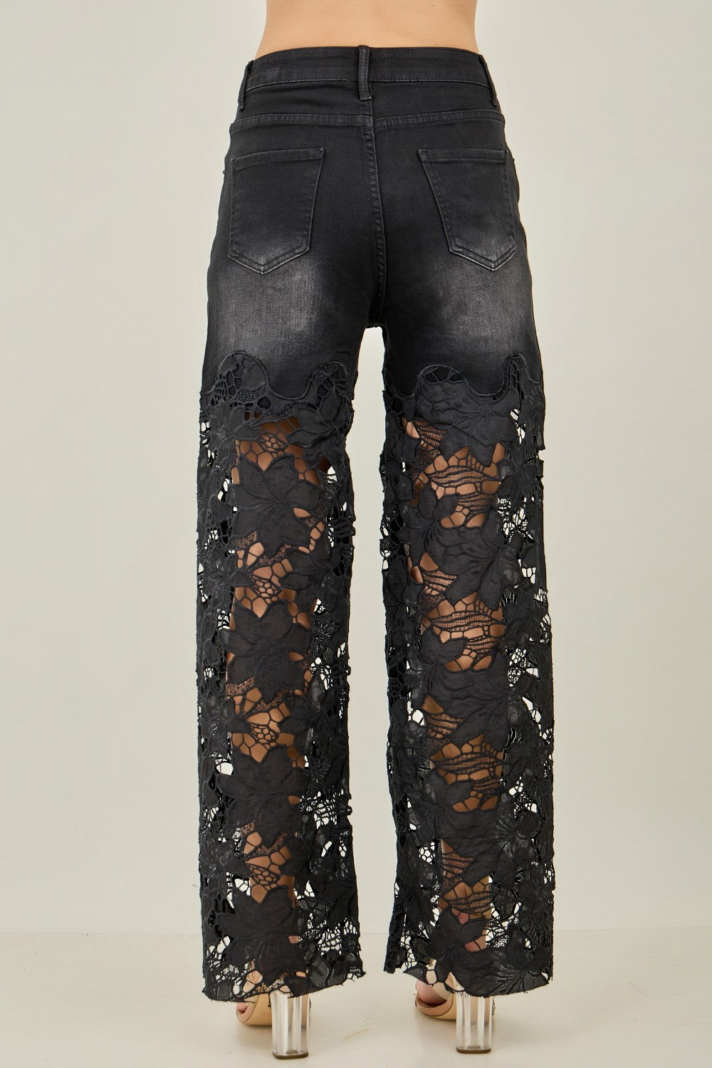 KIWI black wide-leg jeans with pearl stud trim and lace panels on model, full-length back view
