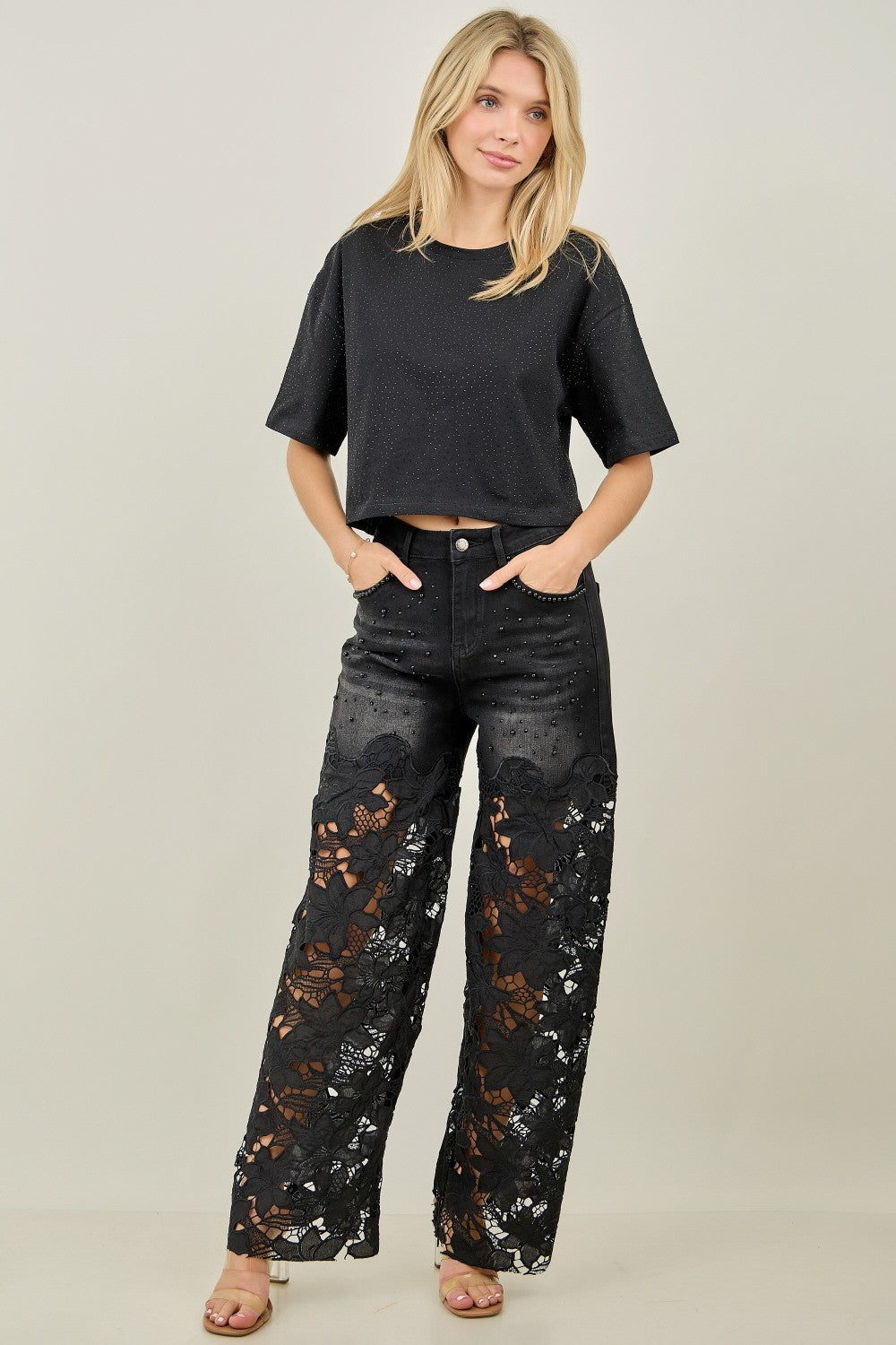 Close-up of KIWI black denim upper with scattered pearl and rhinestone accents, pocket detail
