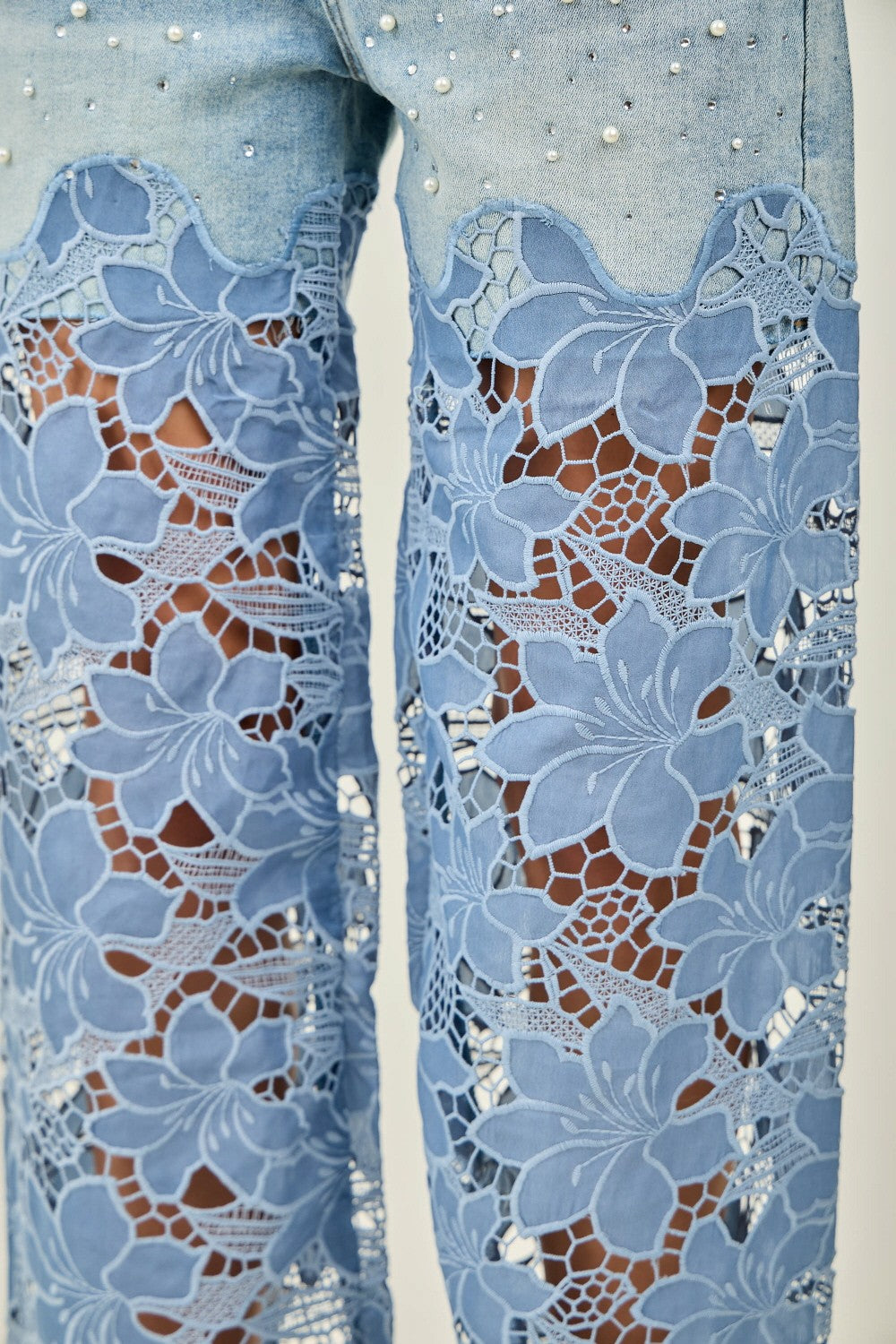 KIWI light denim wide-leg jeans with floral crochet lace panels, full-length front view
