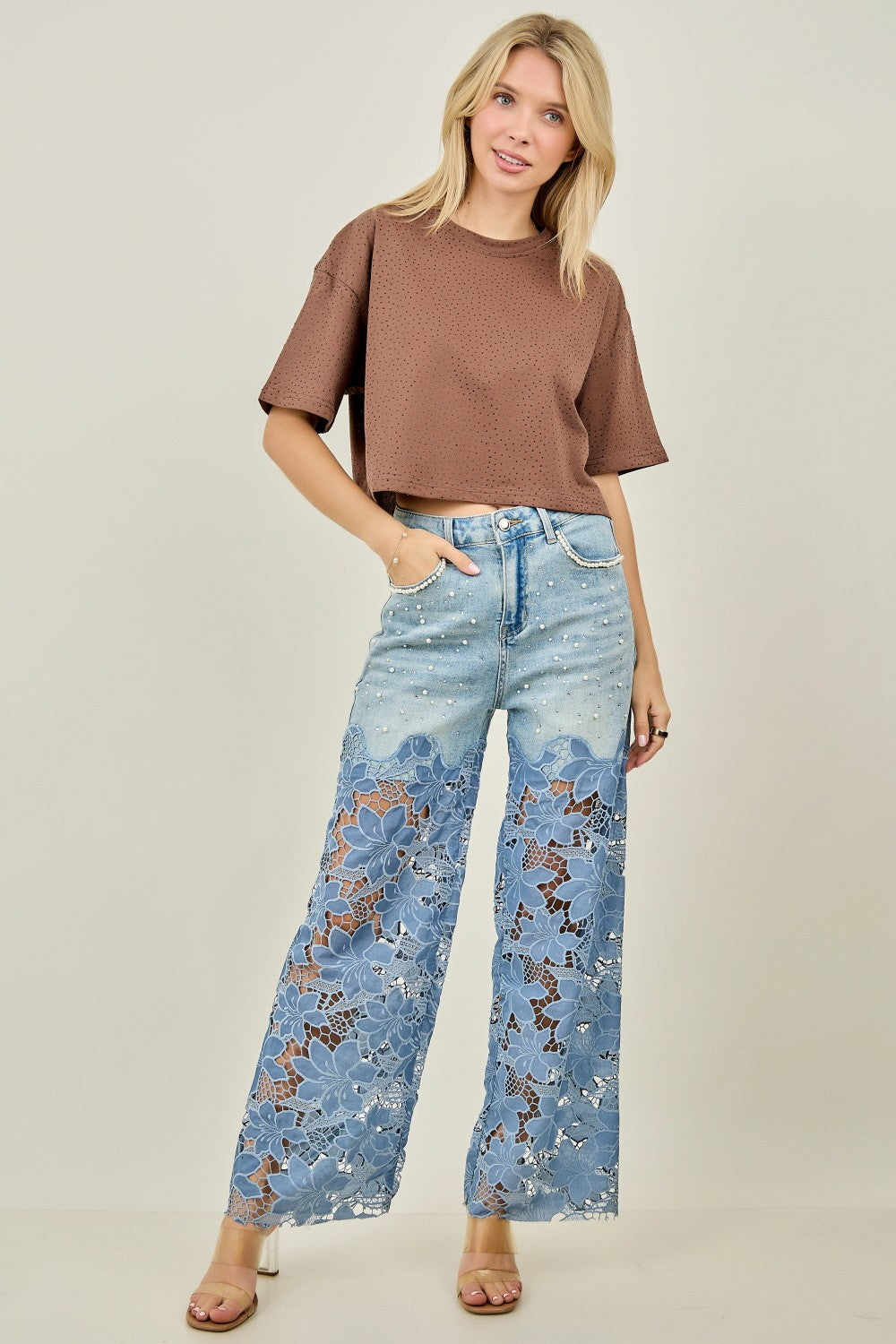 Close-up of KIWI denim upper with scattered pearl and rhinestone accents, pocket detail
