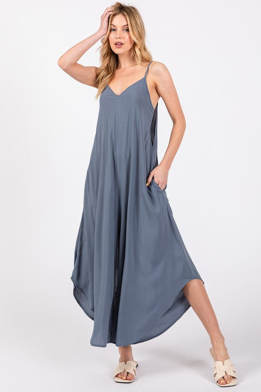 a woman in a gray dress posing for a picture