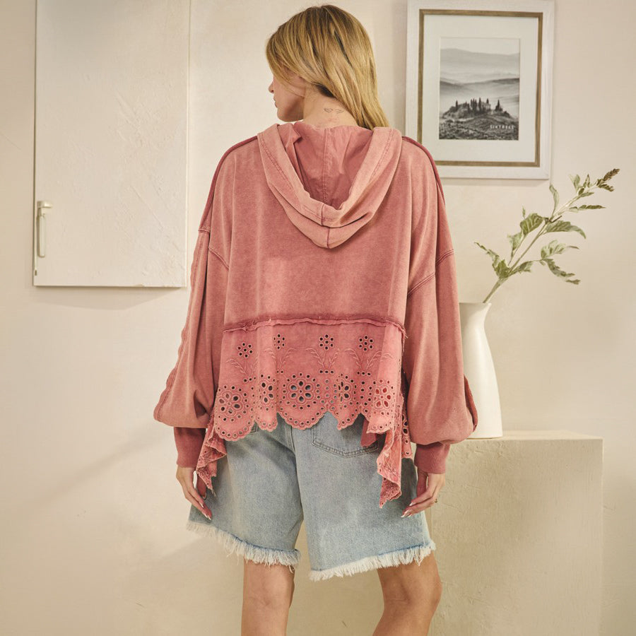 Oli & Hali pink washed terry hoodie sweatshirt on model, back view showing hood, raw-edge seams, and hi-lo eyelet hem
