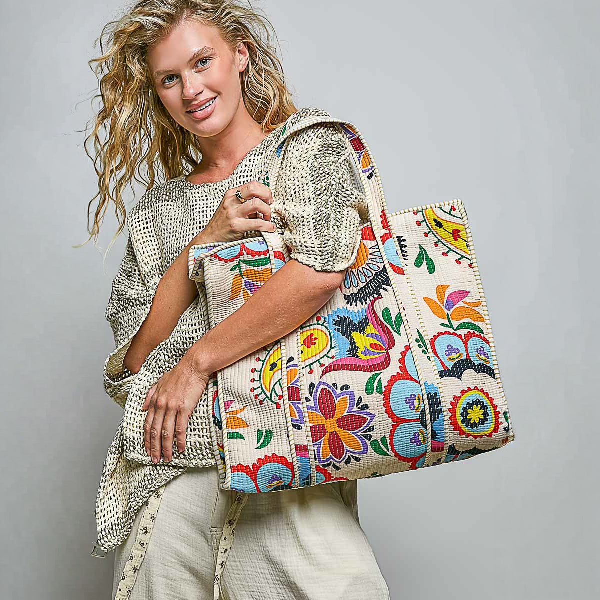 POL Clothing women's Cream Multi colorful quilted tote held close in a casual outfit
