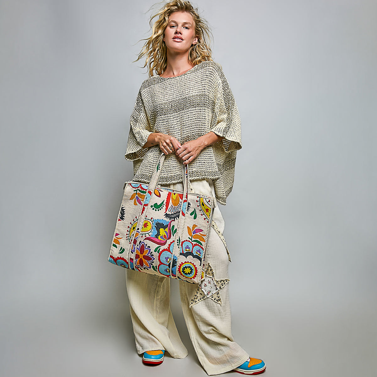 POL Clothing women's Cream Multi bohemian quilted tote shown in a full-length look
