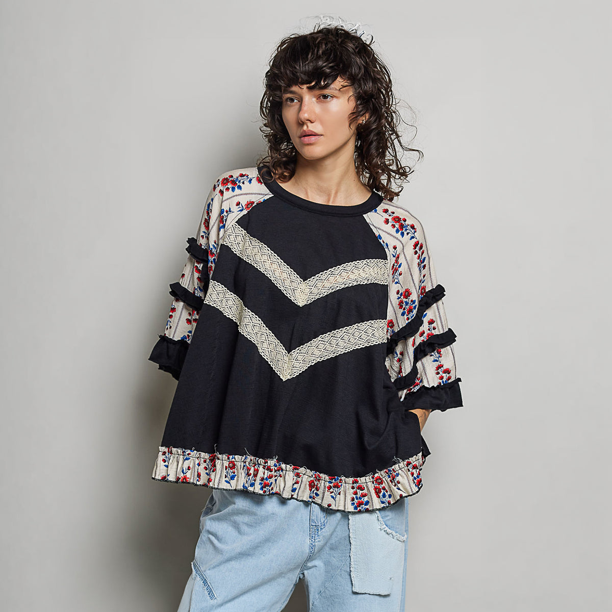 POL Clothing oversized crochet lace knit top side view showing three-quarter floral ruffle sleeves