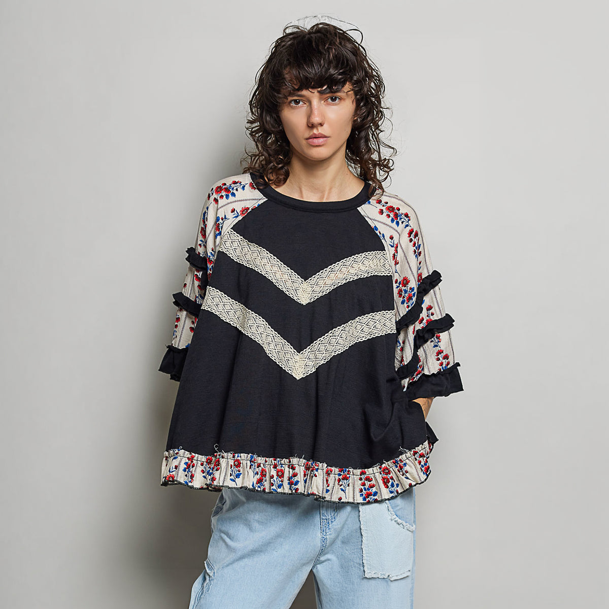 POL Clothing black oversized knit top full-length front view styled with light wash denim