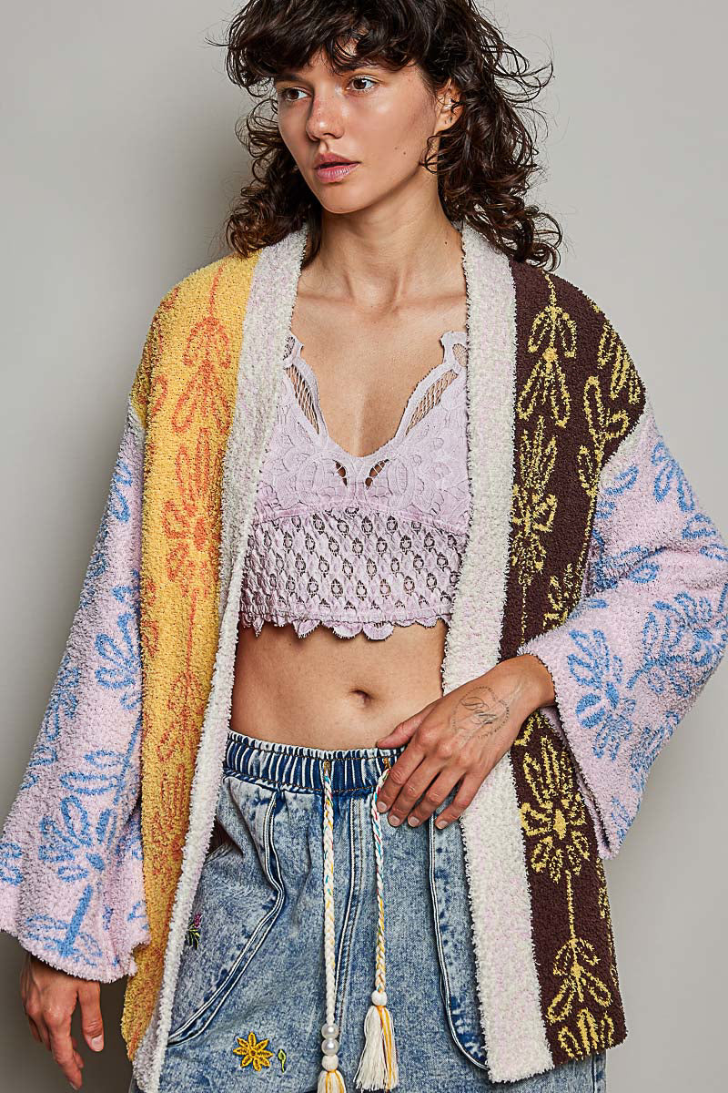 POL Powder Beige Multi colorblock cardigan on model, back view showing yellow and cream floral panel detail
