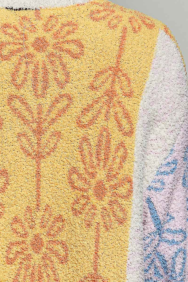 POL Powder Beige Multi colorblock bouclé cardigan on model, side close-up showing sleeve and floral texture
