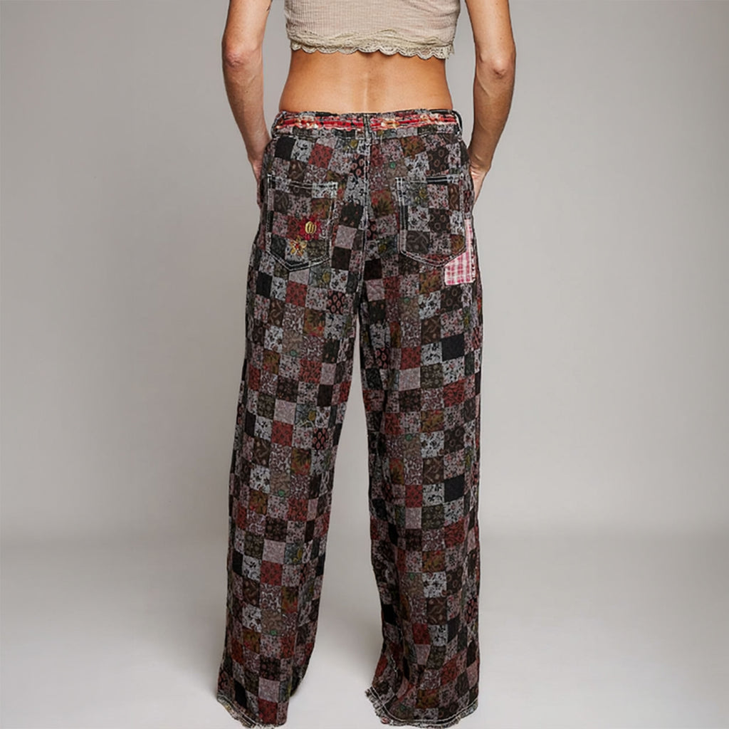 POL Clothing women's burgundy patchwork straight-leg pants, rear view showing back pockets and raw hems