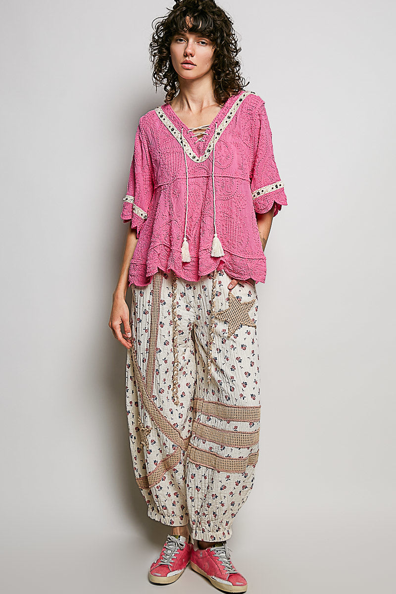 POL women's pink crochet lace-up V-neck tassel blouse, front close-up view on model - BellanBlue