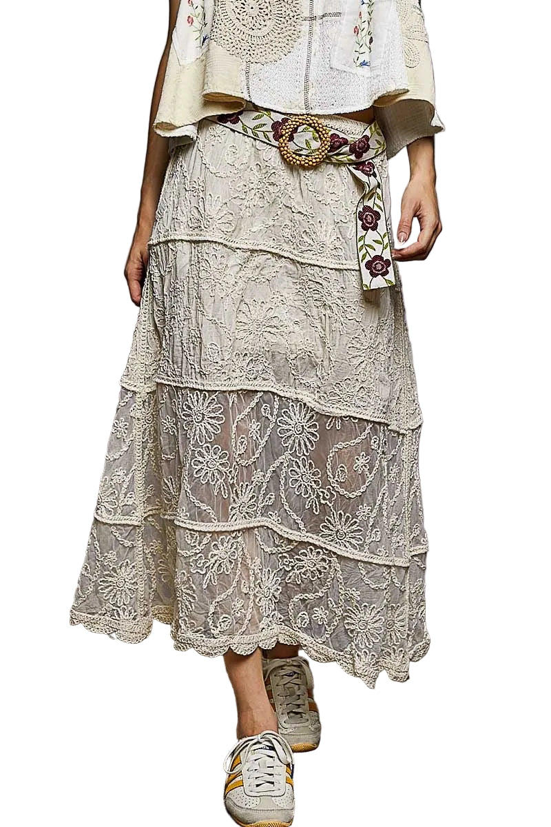 Lace skirt with floral belt and top on a white background