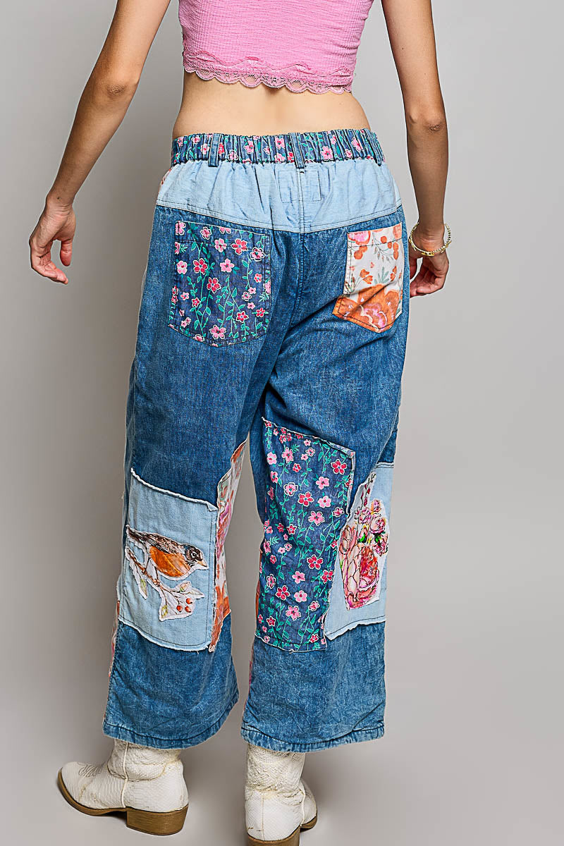 POL Clothing women's POL Patchwork Wide-Leg Denim Pants - Denim Multi styled with matching jacket set in resort courtyard