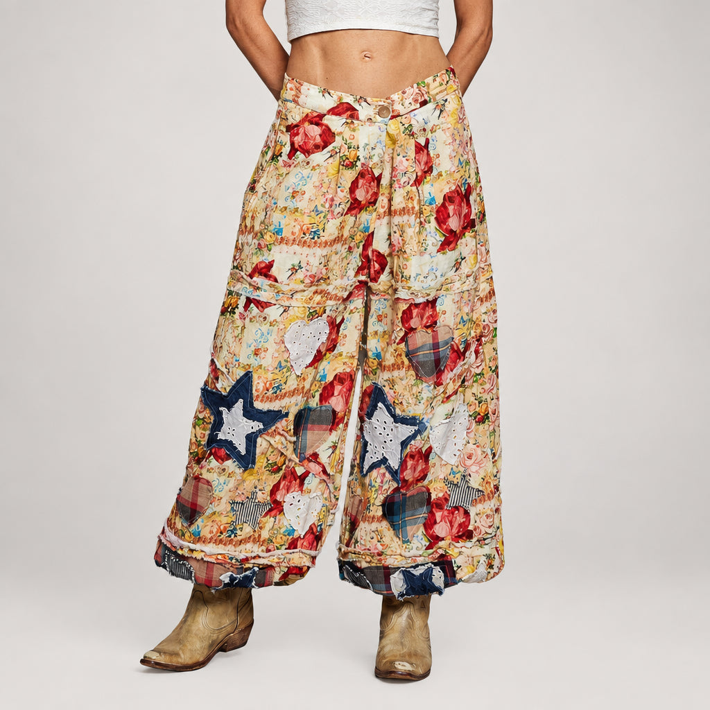 POL Clothing Women's Coral Multi POL Floral Patchwork Jogger Pants with tapered jogger cuffs paired with boots