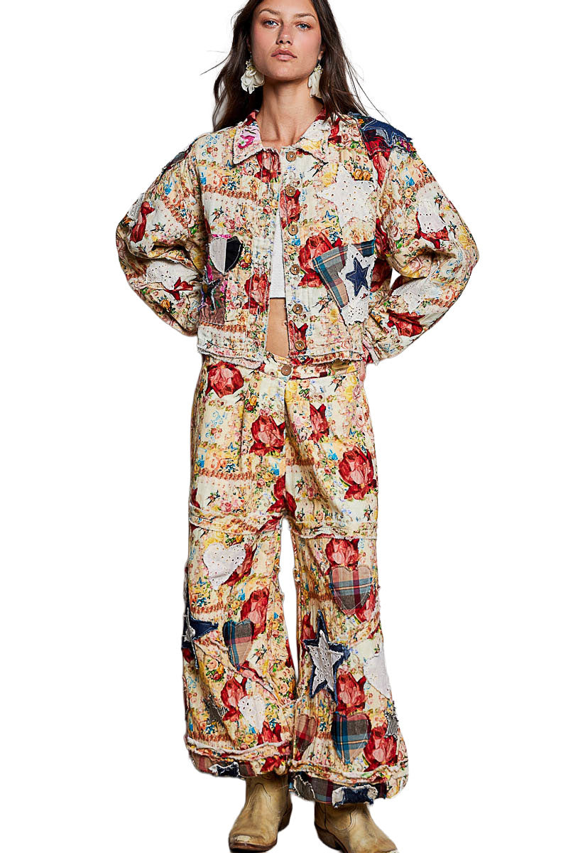 POL Clothing Women's Coral Multi POL Floral Patchwork Jogger Pants styled with matching floral jacket in courtyard