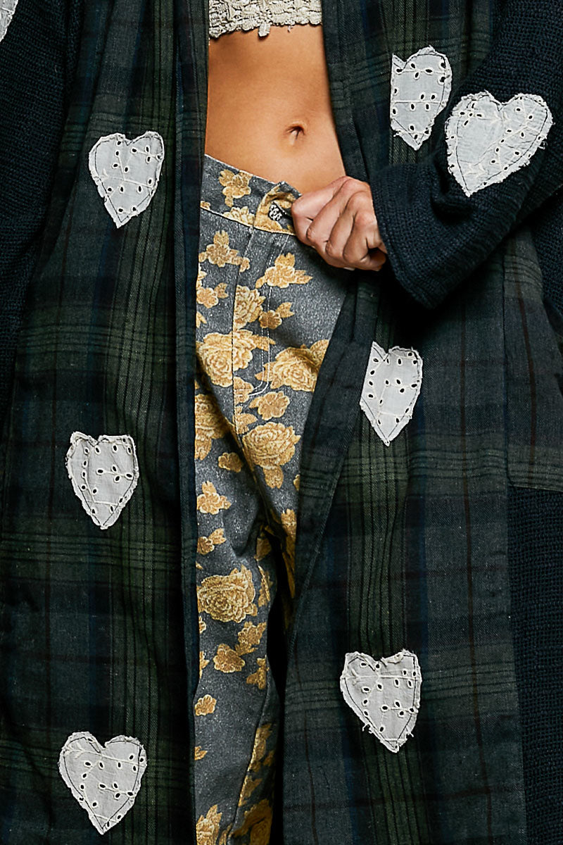 POL Clothing Natural Multi plaid patchwork longline coat, close-up detail of white eyelet lace heart appliqué on back
