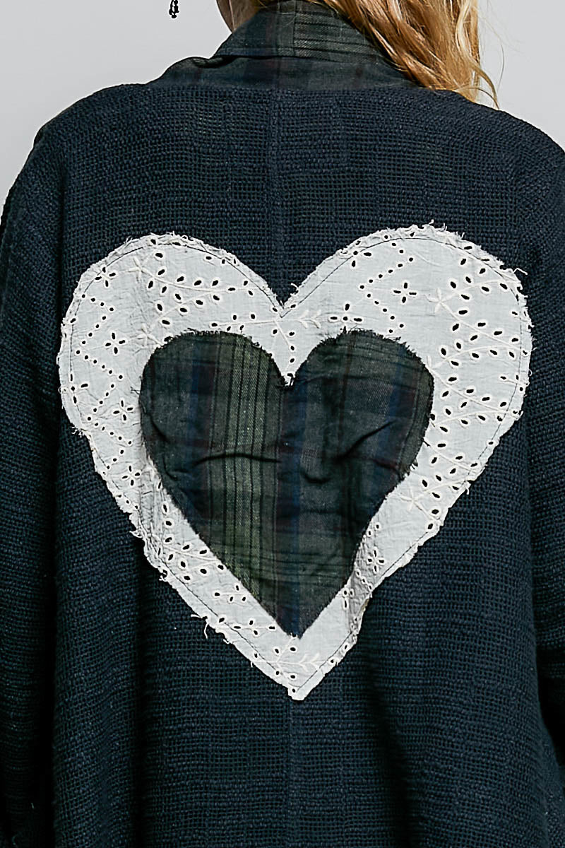 POL Clothing women's dark plaid patchwork longline coat with white eyelet lace hearts, full-length front view on model
