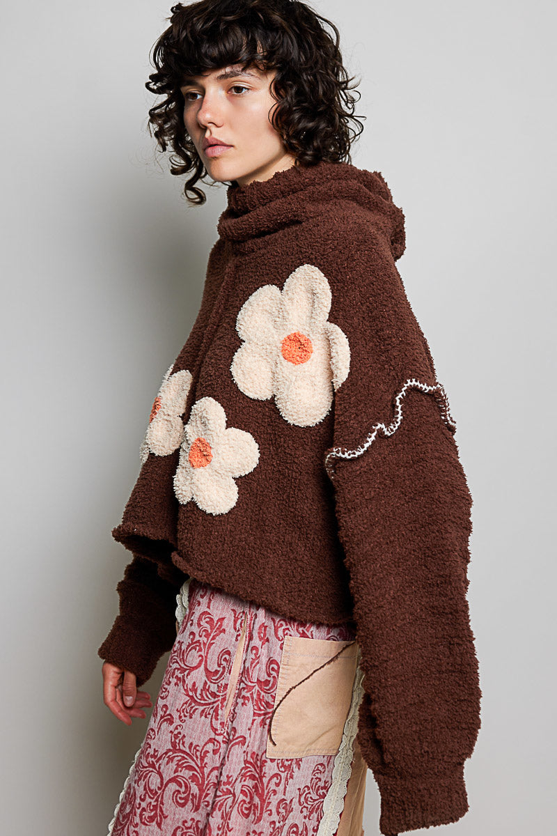 POL Clothing brown boucle turtleneck sweater with daisy appliqués, full-length on model
