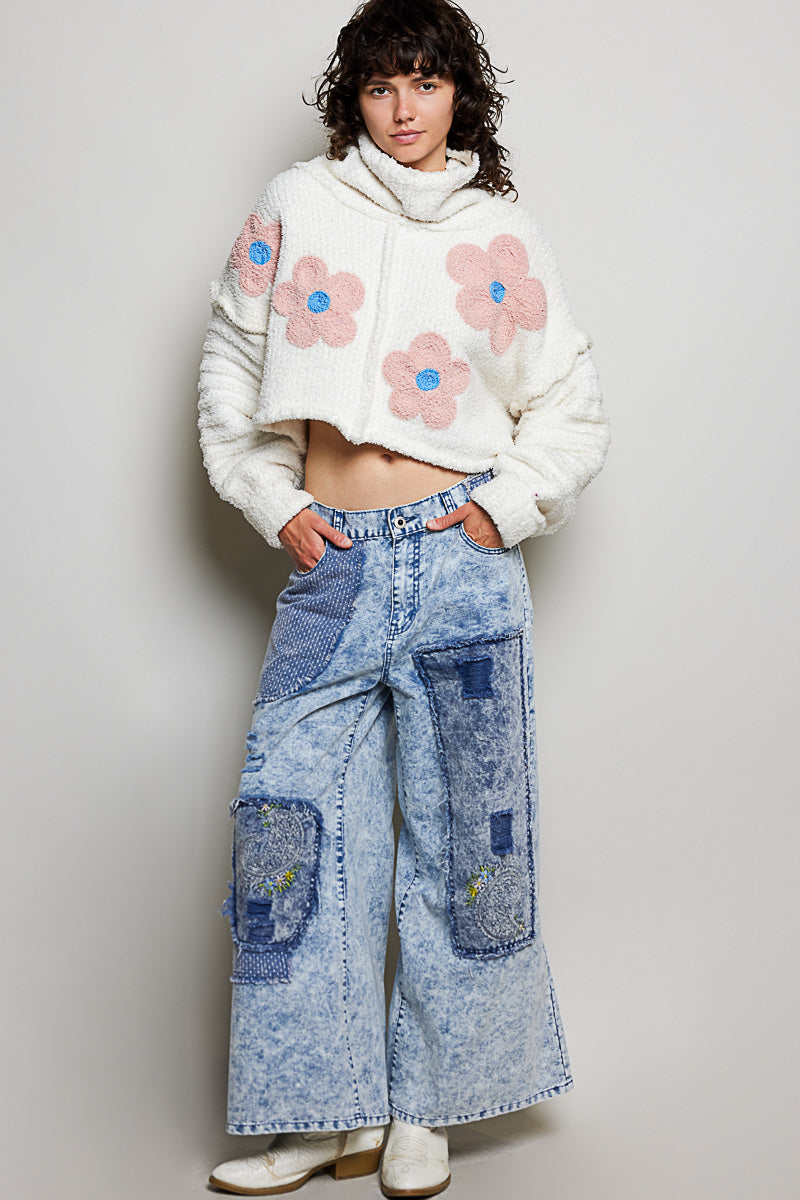 POL Clothing ivory boucle turtleneck sweater with pink daisy appliqués, full-length front view on model

