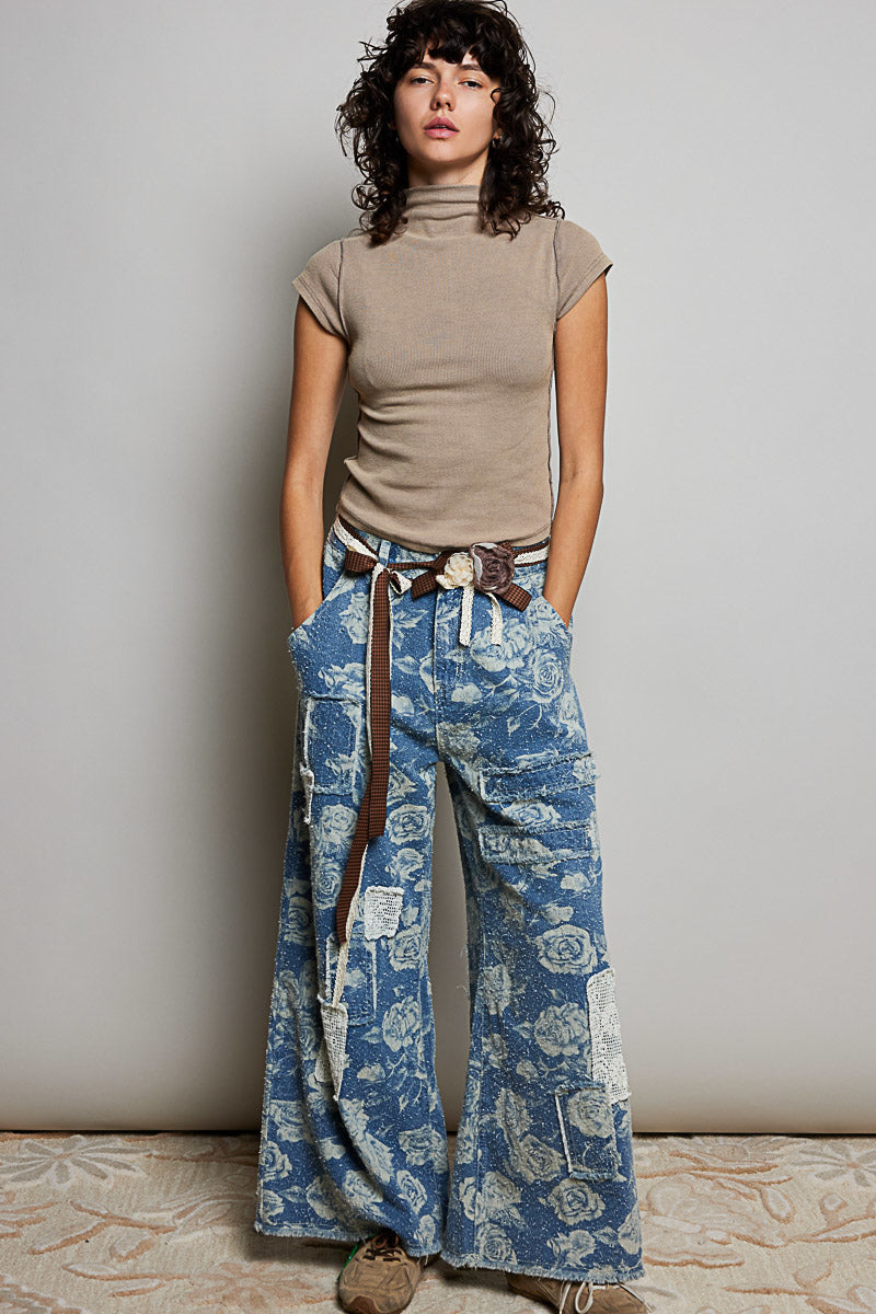 POL Clothing women's blue rose floral wide-leg denim pants with crochet patches, full-length front view on model - BellanBlue
