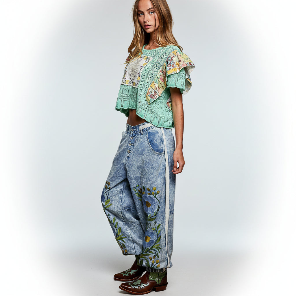 POL women's blue denim floral embroidered jogger pants, full-length front view on model
