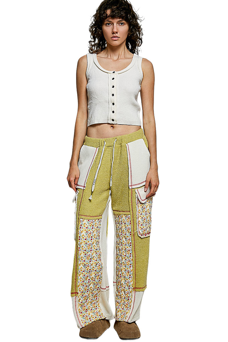 POL Clothing lime green floral patchwork wide-leg pants side view on model with ivory flap pockets