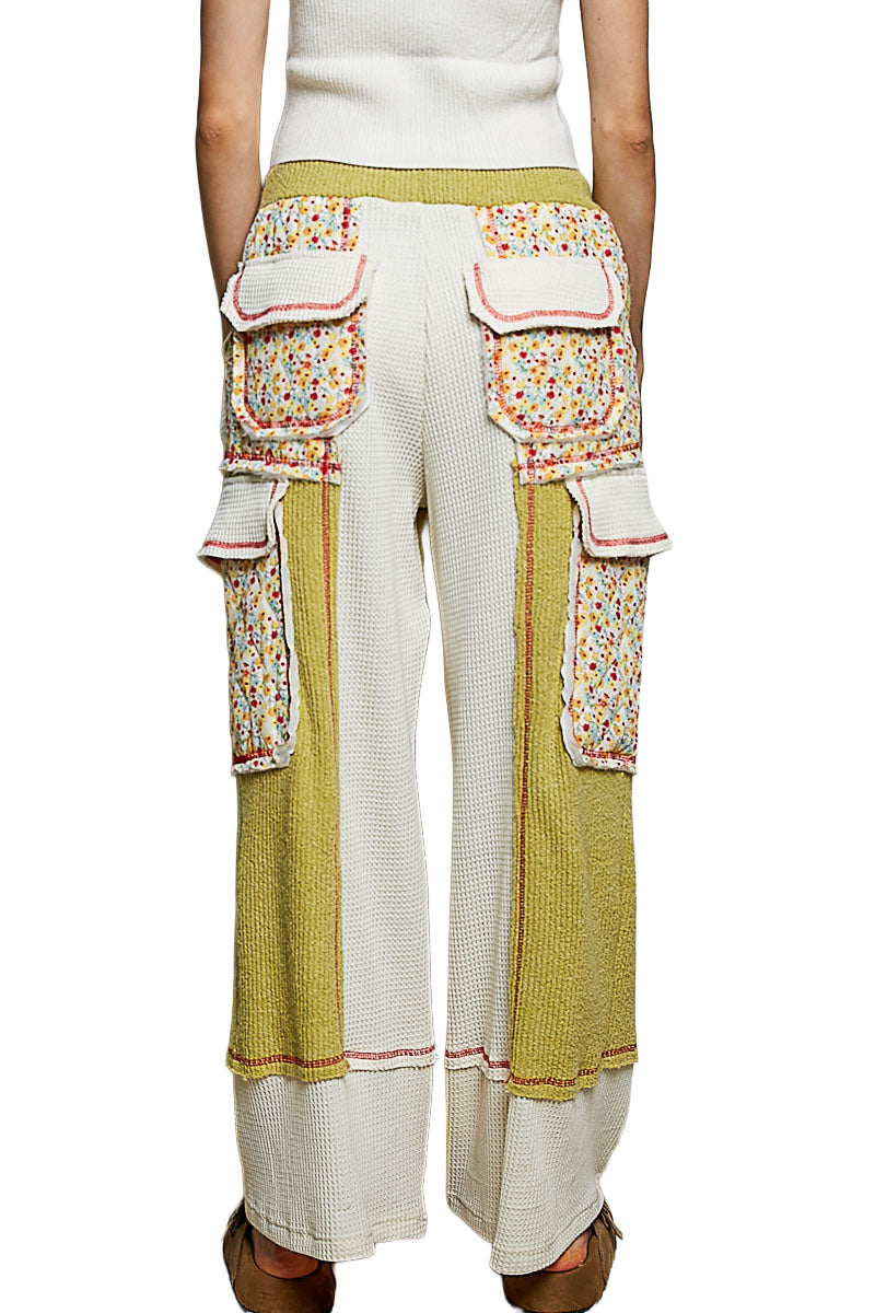 POL Clothing lime green floral patchwork pants full-length front view styled with an ivory tank
