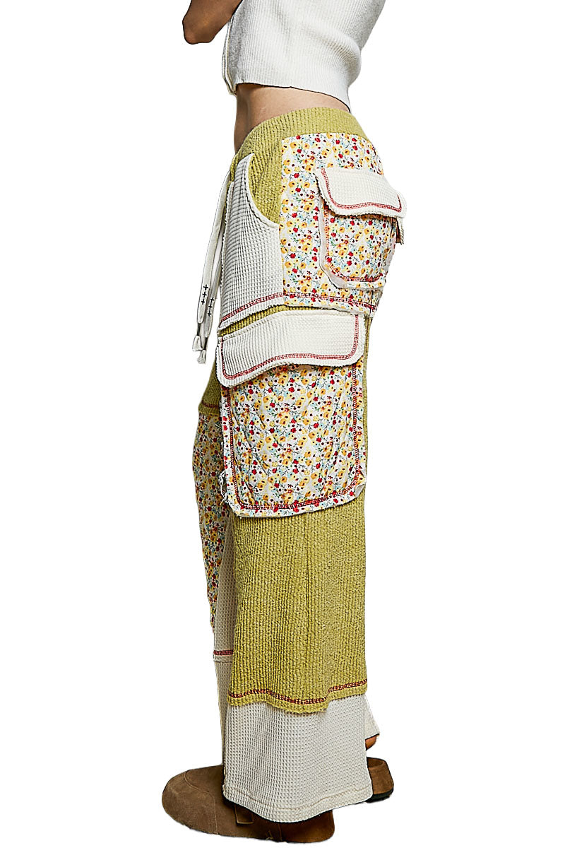 POL Clothing lime green thermal pants side detail of floral flap pockets, ivory hems and red stitching