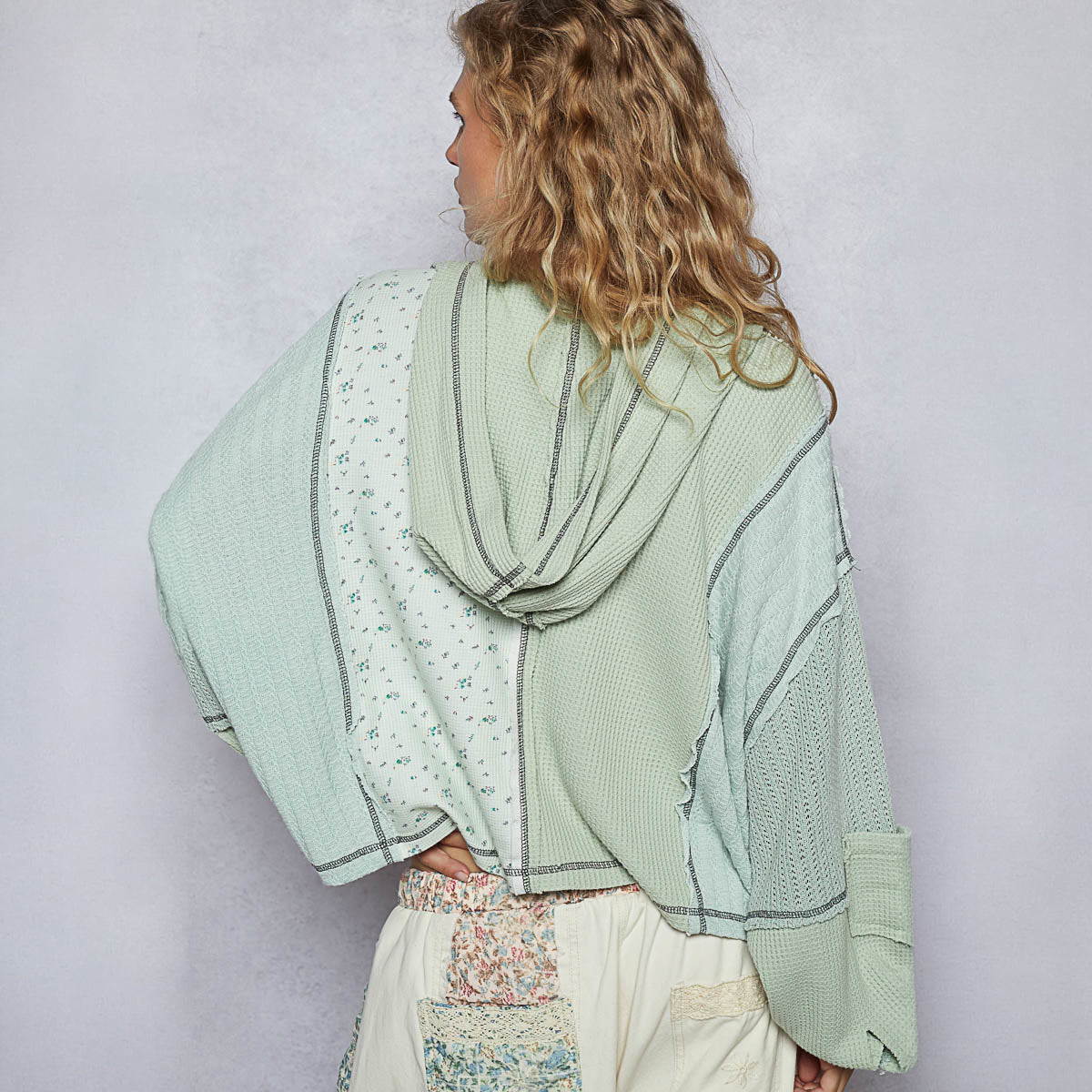 POL Clothing women's pistachio thermal hoodie top, front view on model, patchwork knit panels, balloon sleeves - BellanBlue