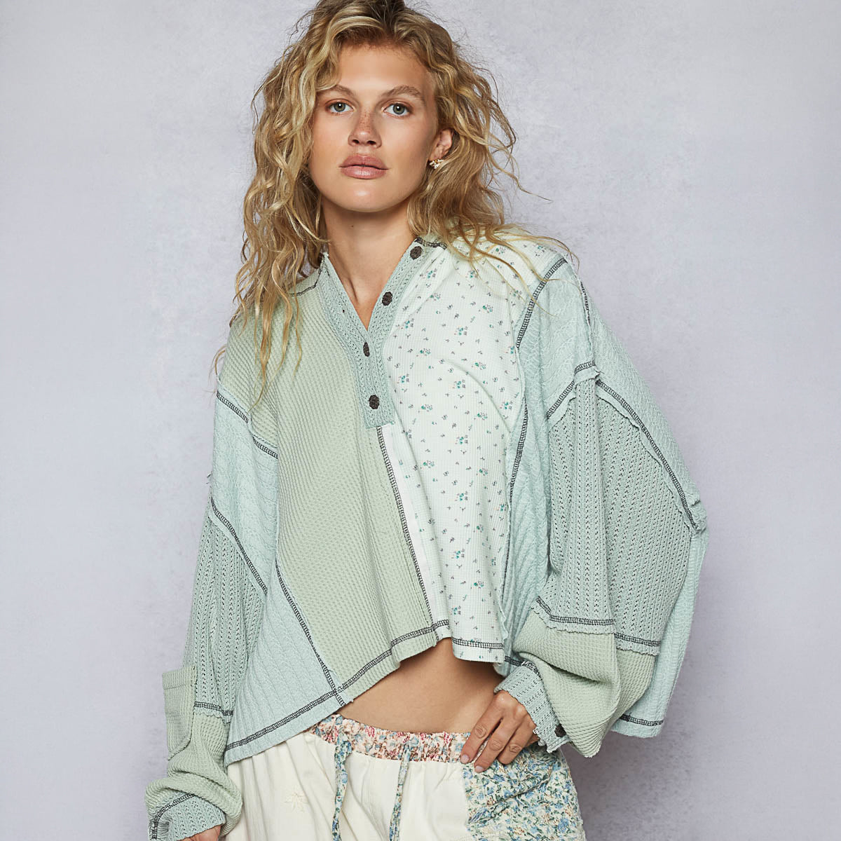 POL Clothing pistachio thermal hoodie top, side profile on model showing oversized balloon sleeve and cropped hem