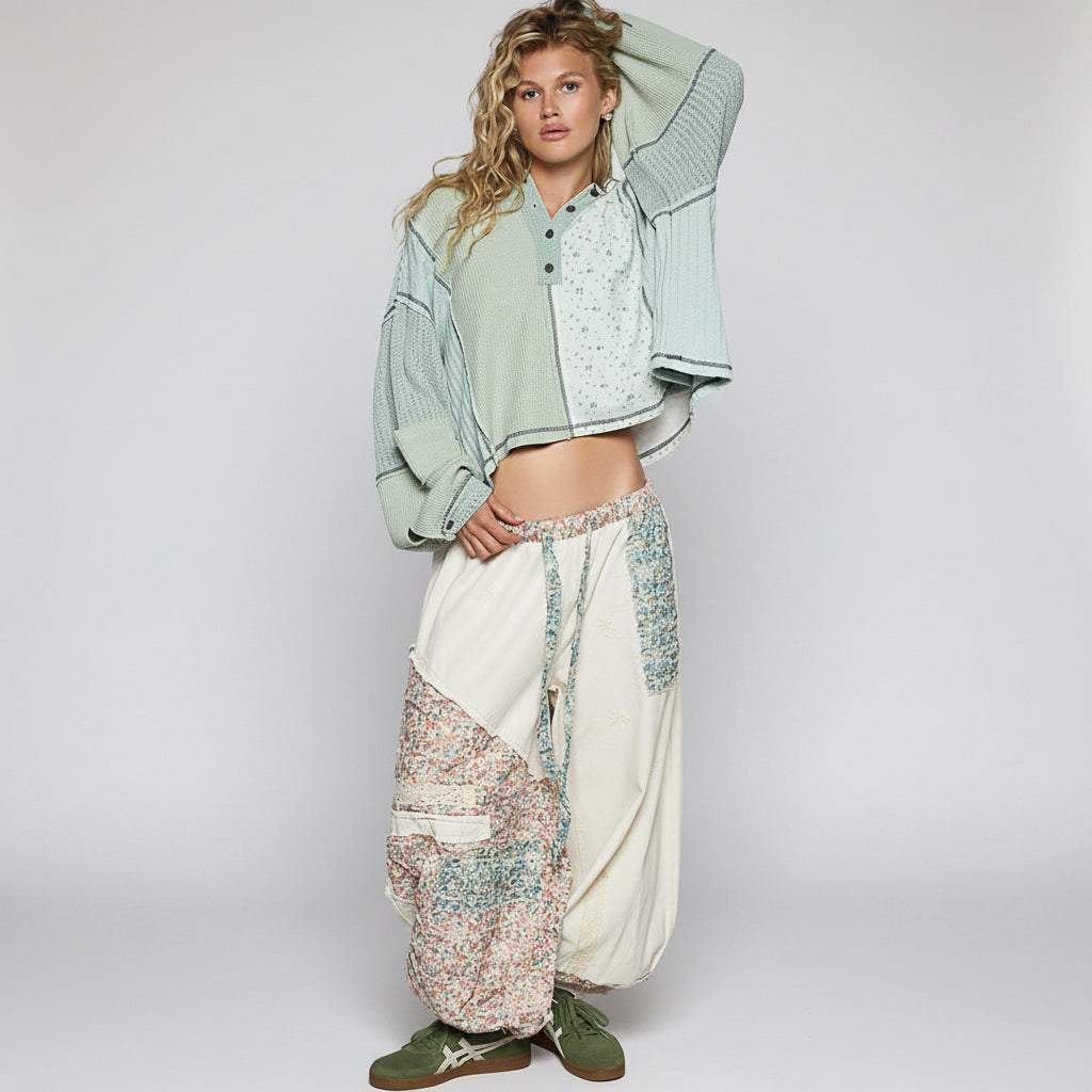 POL Clothing floral point hoodie top, back view on model with draped hood and contrast overlock stitching