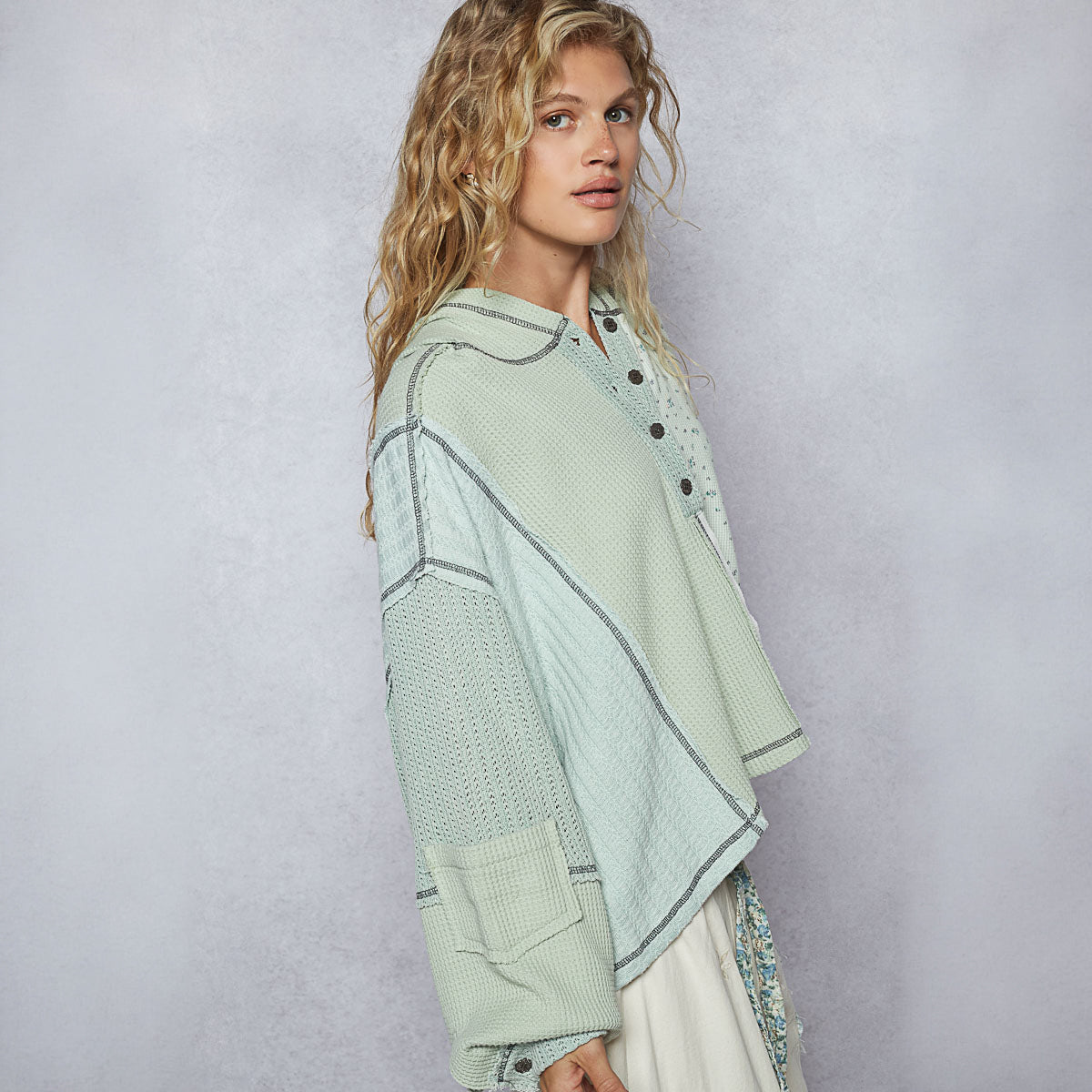 POL Clothing floral point thermal hoodie, close-up view showing button placket and thermal knit texture