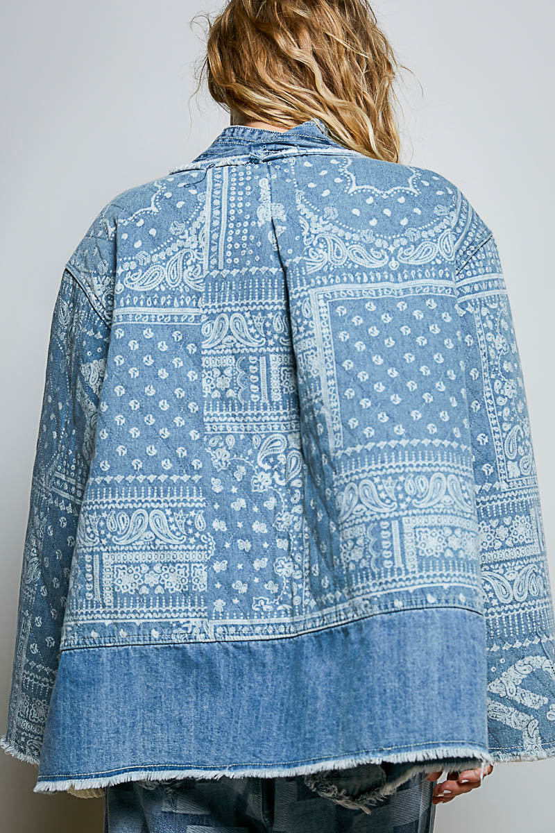 POL Clothing denim patchwork quilted jacket, back view showing bandana paisley print and raw-edge hem on model
