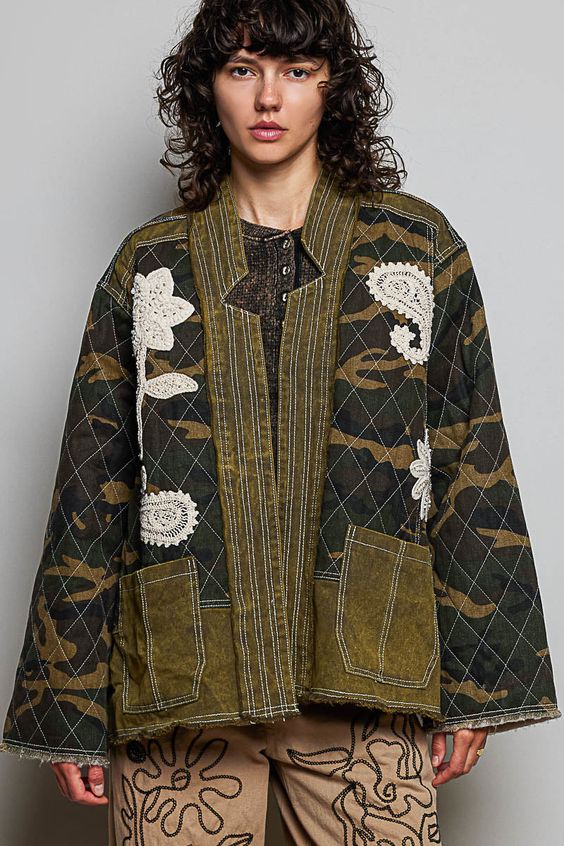 POL Clothing olive camo quilted jacket styled with embroidered wide-leg pants and western boots, full-length on model
