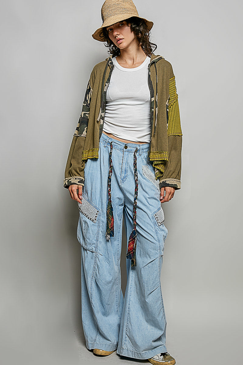 POL Clothing olive mixed-fabric hoodie side view with textured balloon sleeve and camo panel