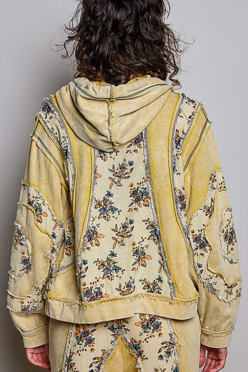 POL Clothing women's lemon floral patchwork zip-up hoodie front view with hood up and raw-edge panels