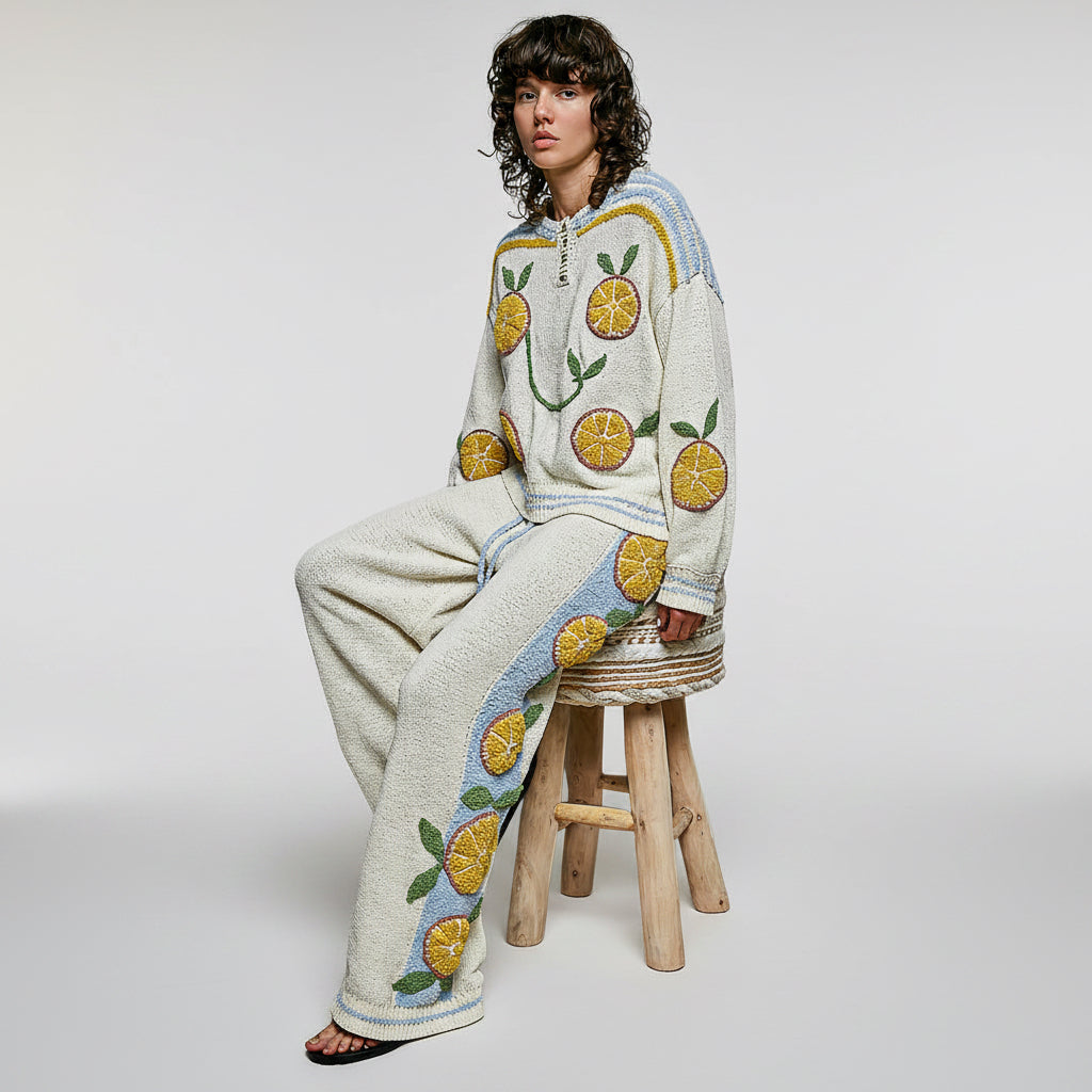 POL Clothing women's citrus fruit appliqué wide leg knit pants full view in garden setting