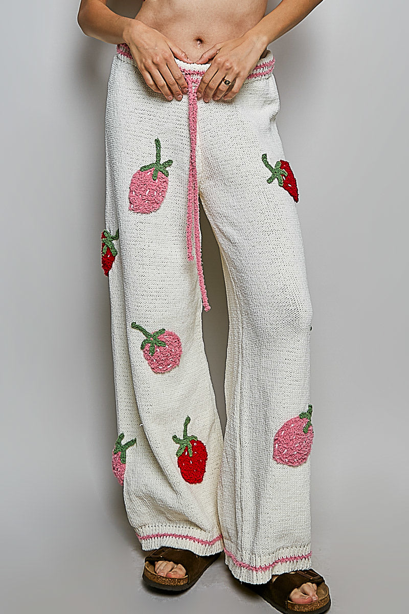 POL Clothing cream wide-leg strawberry pants, front waist detail showing pink crochet waistband and drawstring
