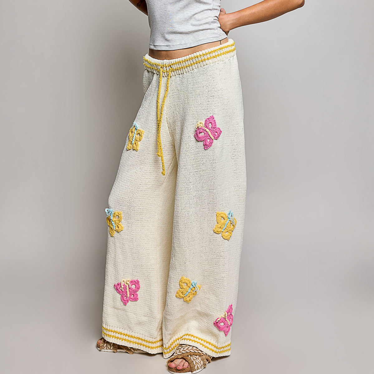 POL Clothing cream multi wide leg knit pants, full-length side view showing wide-leg silhouette on model
