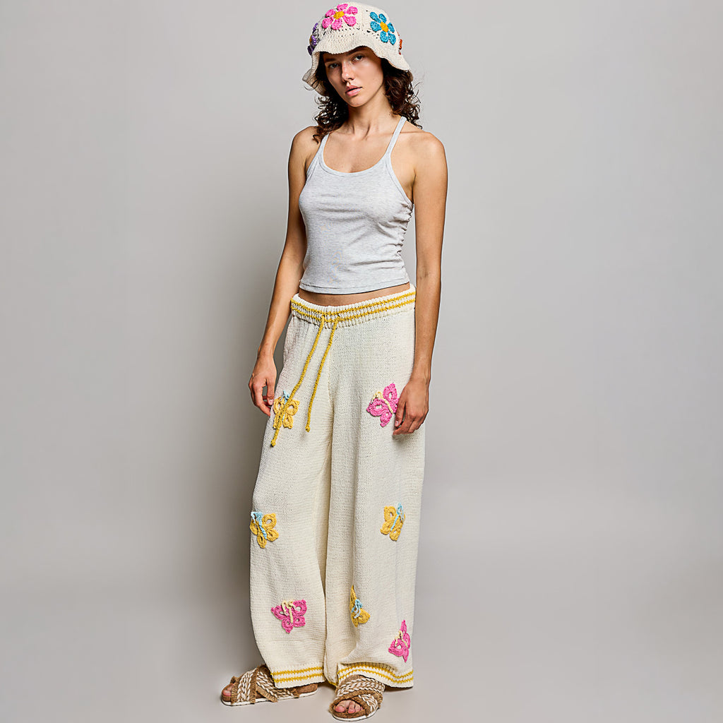 POL Clothing cream multi crochet butterfly wide leg knit pants styled with matching butterfly knit sweater, full set view
