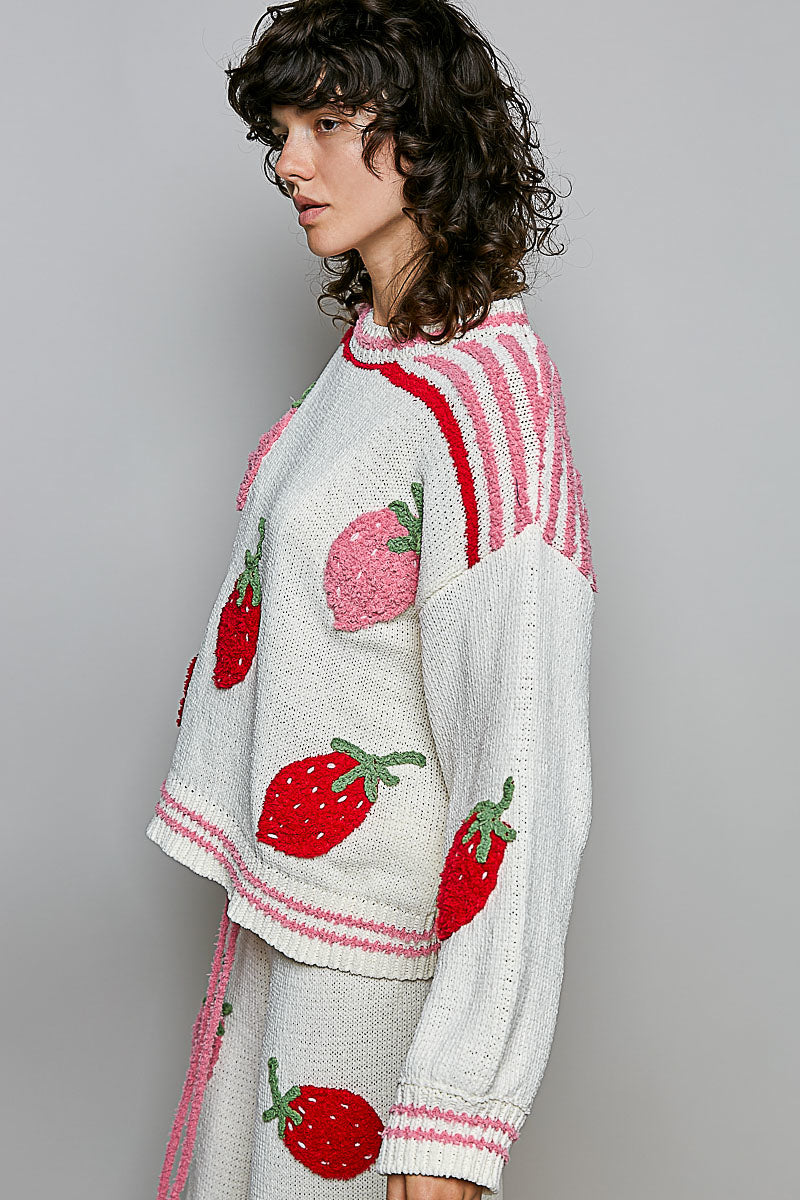 POL Clothing cream knit sweater, red and pink 3D strawberry appliques, on model close-up front view
