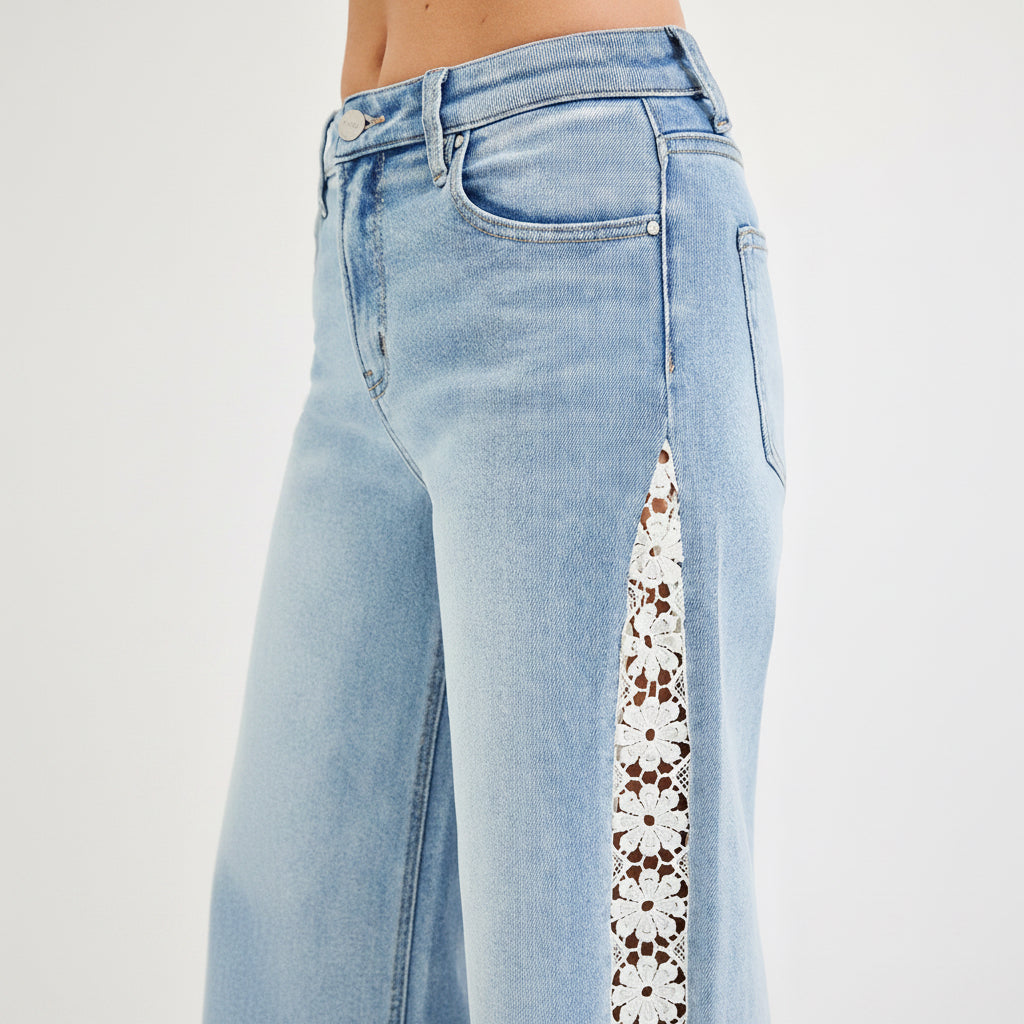 Risen high rise wide leg crop jeans front model view with light wash denim and floral lace side panels
